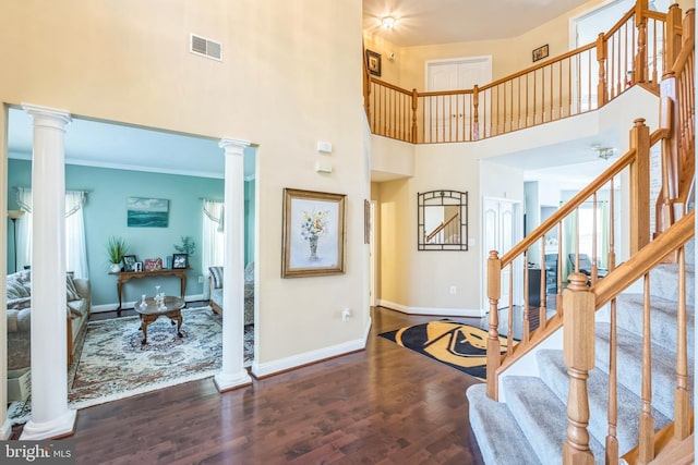 14165 Shelwick Pl, Hughesville, MD 20637 - foyer featuring baseboards, wood finished floors, visible vents, and ornate columns