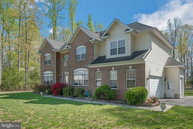 14165 Shelwick Pl, Hughesville, MD 20637 - view of front facade with brick siding, driveway, and a front yard