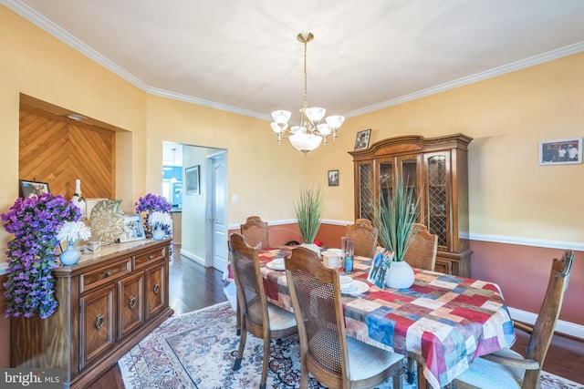 14165 Shelwick Pl, Hughesville, MD 20637 - dining space featuring baseboards, ornamental molding, a chandelier, and dark wood-type flooring
