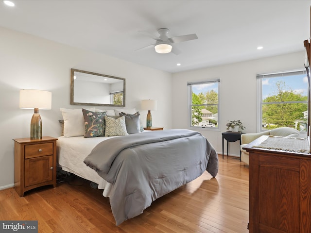 bedroom with light wood-style floors, recessed lighting, and a ceiling fan