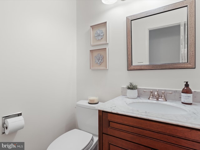 half bath with vanity and toilet
