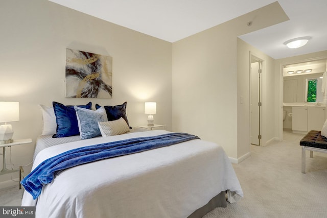 851 N Glebe Rd Unit 321, Arlington, VA 22203 - bedroom featuring baseboards, ensuite bathroom, and light carpet