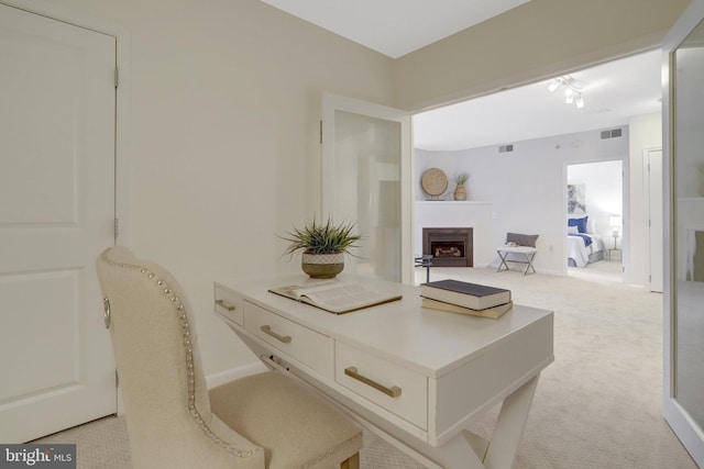 851 N Glebe Rd Unit 321, Arlington, VA 22203 - home office with baseboards, visible vents, a fireplace, and light colored carpet