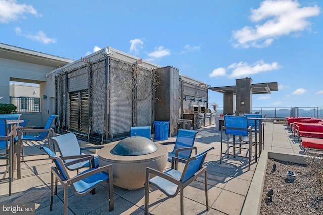 851 N Glebe Rd Unit 321, Arlington, VA 22203 - view of patio / terrace featuring an outdoor fire pit