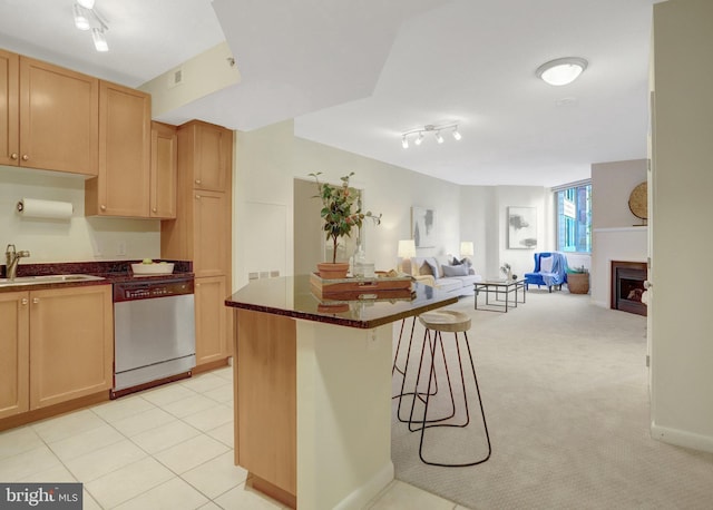851 N Glebe Rd Unit 321, Arlington, VA 22203 - kitchen featuring a kitchen breakfast bar, dishwasher, a sink, track lighting, and open floor plan