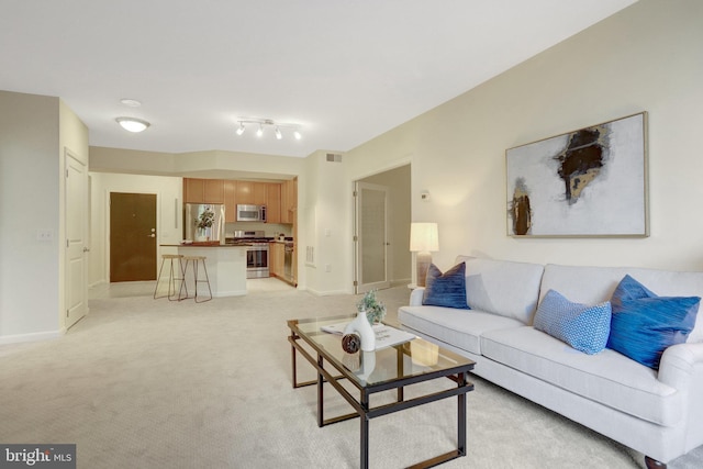 851 N Glebe Rd Unit 321, Arlington, VA 22203 - living area featuring baseboards, visible vents, and light carpet