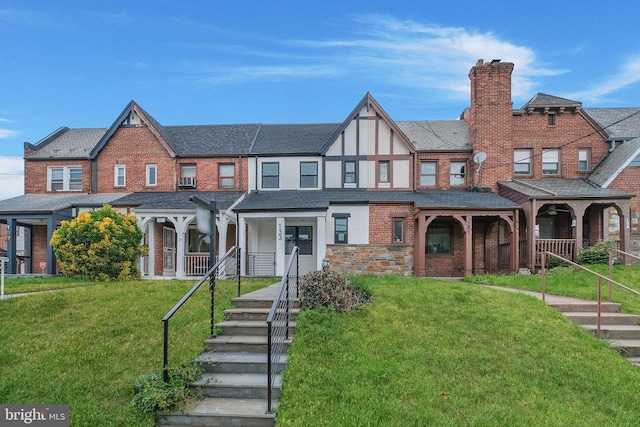 133 Ingraham St NW, Washington, DC 20011 - view of front of property featuring a front yard, a porch, brick siding, and a chimney
