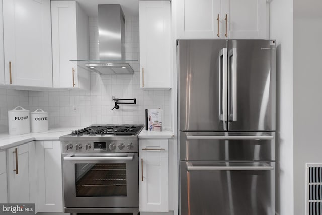 133 Ingraham St NW, Washington, DC 20011 - kitchen with wall chimney exhaust hood, white cabinetry, and stainless steel appliances