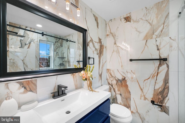 133 Ingraham St NW, Washington, DC 20011 - full bath featuring toilet, a marble finish shower, vanity, and tile walls