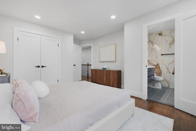 133 Ingraham St NW, Washington, DC 20011 - bedroom featuring recessed lighting, ensuite bathroom, a closet, and wood finished floors