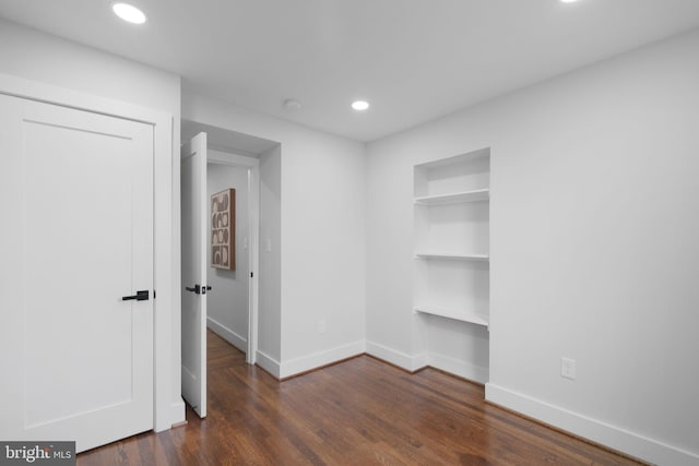 133 Ingraham St NW, Washington, DC 20011 - unfurnished bedroom with a closet, baseboards, dark wood-style floors, and recessed lighting