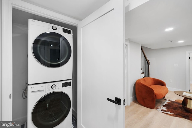 133 Ingraham St NW, Washington, DC 20011 - laundry room with laundry area, recessed lighting, stacked washer / dryer, wood finished floors, and baseboards