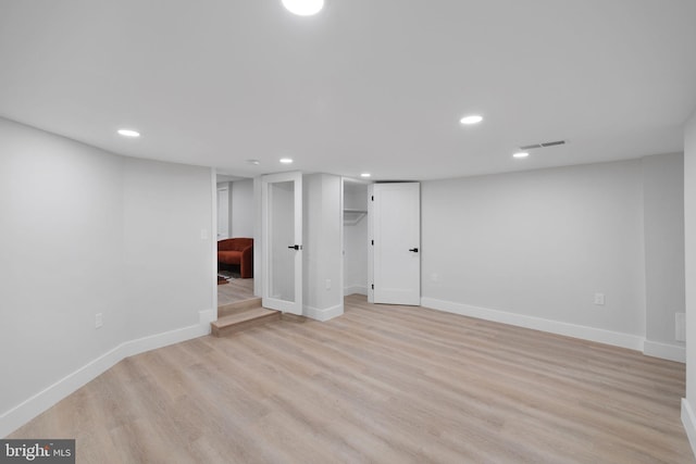 133 Ingraham St NW, Washington, DC 20011 - finished below grade area with light wood-style flooring, baseboards, visible vents, and recessed lighting