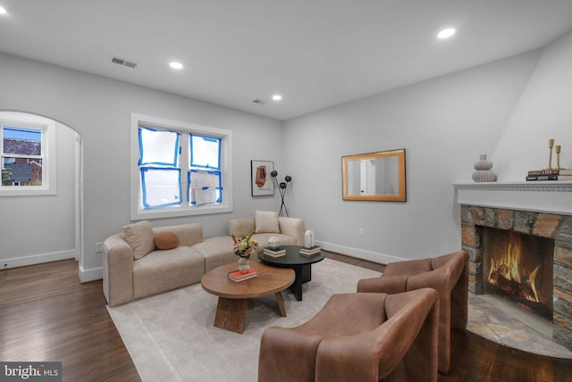 133 Ingraham St NW, Washington, DC 20011 - living area with visible vents, baseboards, wood finished floors, and a fireplace