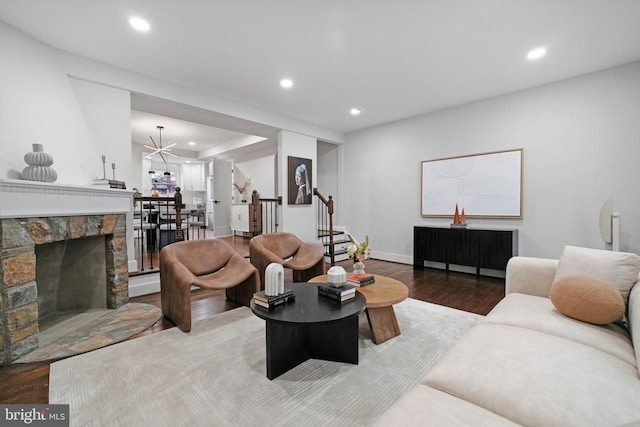 133 Ingraham St NW, Washington, DC 20011 - living area with baseboards, a fireplace, recessed lighting, wood finished floors, and stairs