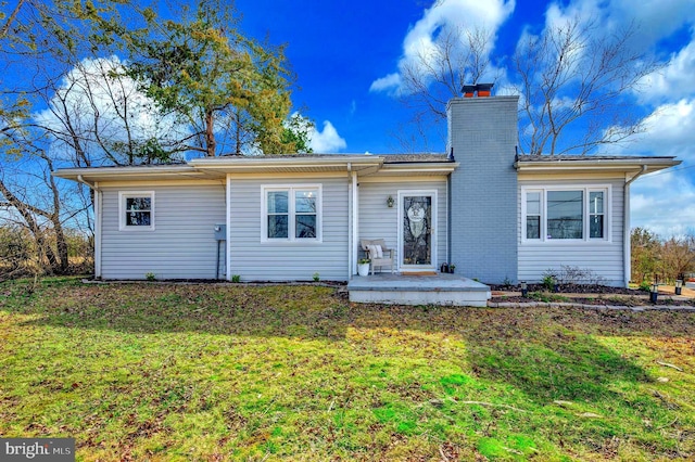 522 White Oak Rd, Fredericksburg, VA 22405 - rear view of property featuring a yard and a chimney