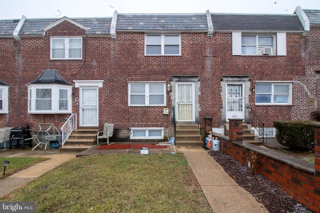 7834 Fayette St, Philadelphia, PA 19150 - view of property with entry steps, brick siding, and cooling unit