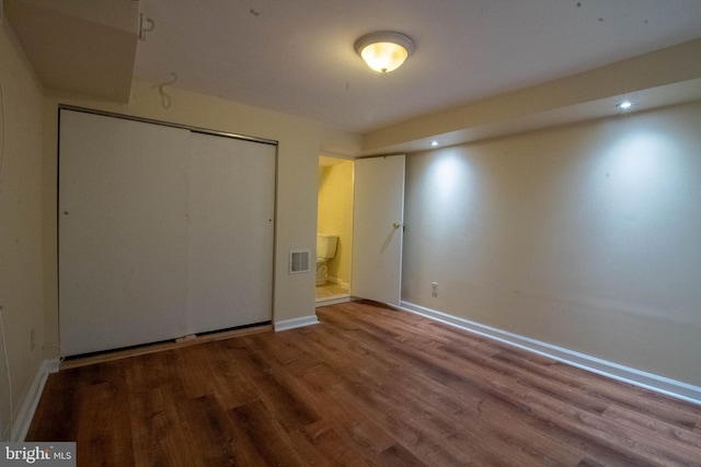 7834 Fayette St, Philadelphia, PA 19150 - unfurnished bedroom with baseboards, visible vents, wood finished floors, a closet, and ensuite bath