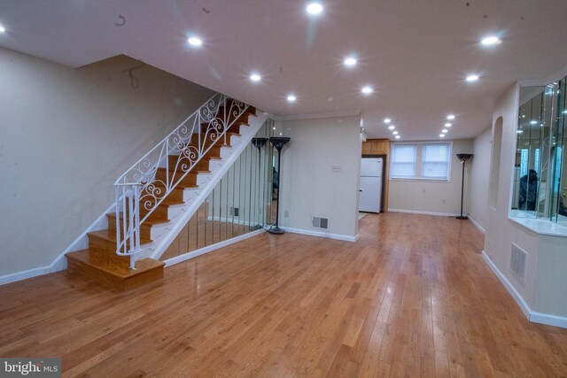 7834 Fayette St, Philadelphia, PA 19150 - unfurnished living room with light wood-style flooring, visible vents, recessed lighting, and stairway