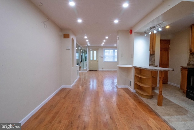 7834 Fayette St, Philadelphia, PA 19150 - interior space featuring light wood-style flooring, baseboards, recessed lighting, open shelves, and brown cabinetry