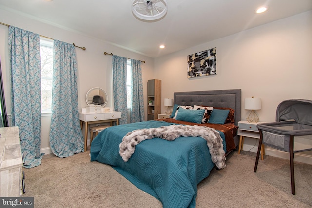 bedroom featuring recessed lighting, carpet flooring, and multiple windows