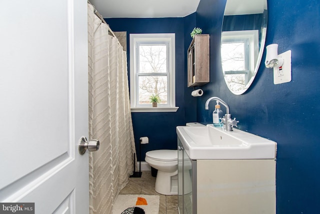 full bath with vanity, tile patterned floors, and toilet