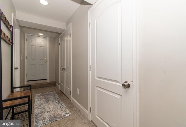 corridor with baseboards and recessed lighting