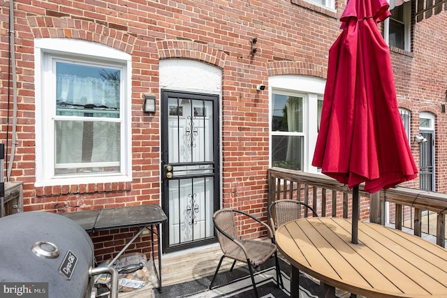 wooden deck featuring outdoor dining area
