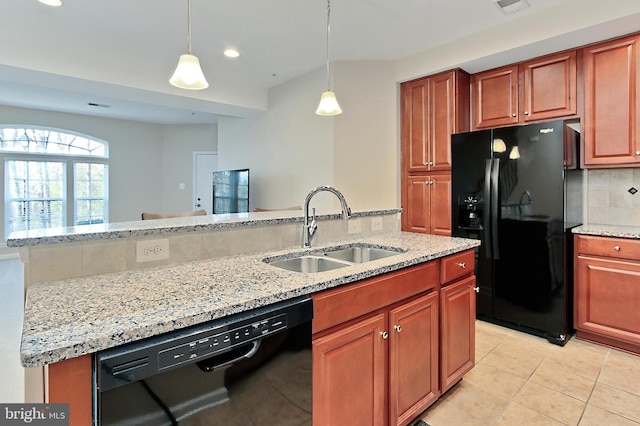 kitchen featuring light stone counters, a sink, black appliances, decorative backsplash, and light tile patterned floors