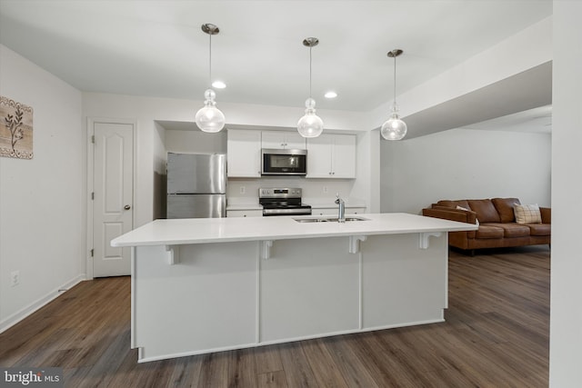 172 Scotch Pine Dr, Bunker Hill, WV 25413 - kitchen with white cabinetry, stainless steel appliances, light countertops, a sink, and dark wood-style floors