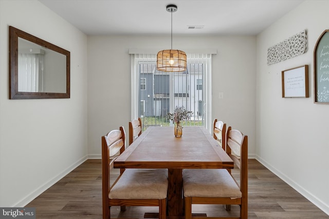 172 Scotch Pine Dr, Bunker Hill, WV 25413 - dining space featuring a notable chandelier, visible vents, wood finished floors, and baseboards