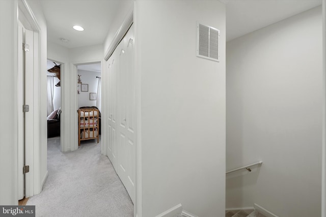 172 Scotch Pine Dr, Bunker Hill, WV 25413 - hall featuring recessed lighting, an upstairs landing, visible vents, baseboards, and light colored carpet