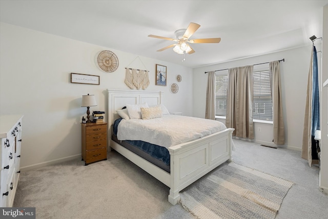 172 Scotch Pine Dr, Bunker Hill, WV 25413 - bedroom featuring baseboards, visible vents, a ceiling fan, and light colored carpet