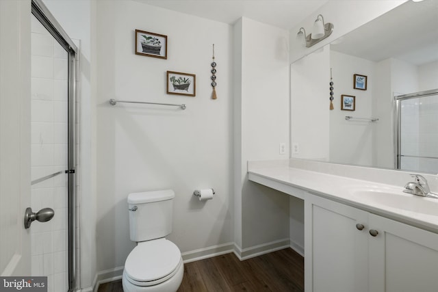 172 Scotch Pine Dr, Bunker Hill, WV 25413 - full bath with baseboards, toilet, wood finished floors, vanity, and tiled shower