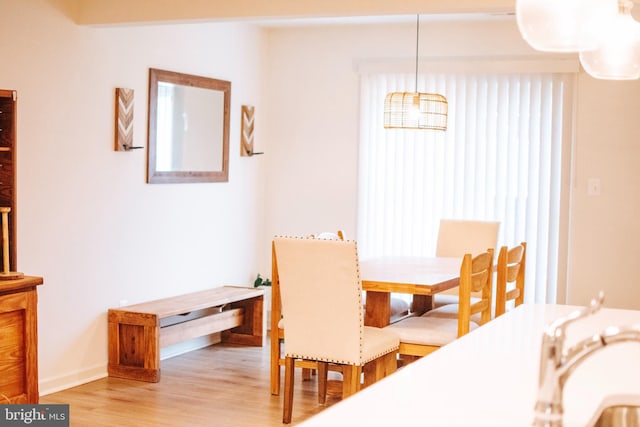 172 Scotch Pine Dr, Bunker Hill, WV 25413 - dining space featuring light wood-style flooring and baseboards