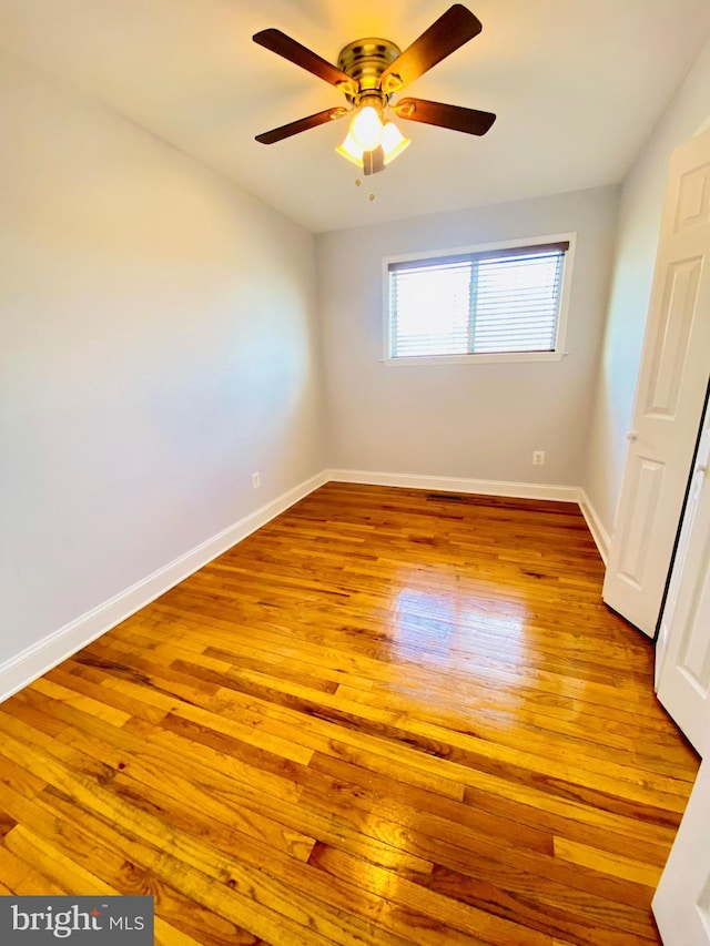 8107 Candle Ln, Baltimore, MD 21237 - empty room with baseboards, a ceiling fan, and wood finished floors