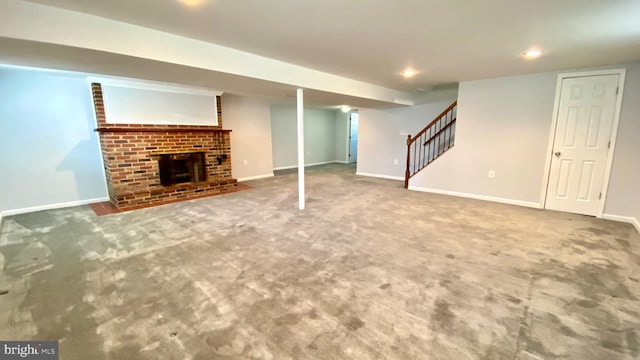 8107 Candle Ln, Baltimore, MD 21237 - finished basement with a fireplace, baseboards, stairs, and carpet