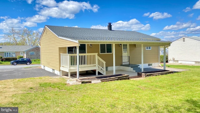 8107 Candle Ln, Baltimore, MD 21237 - rear view of house featuring a yard and roof with shingles