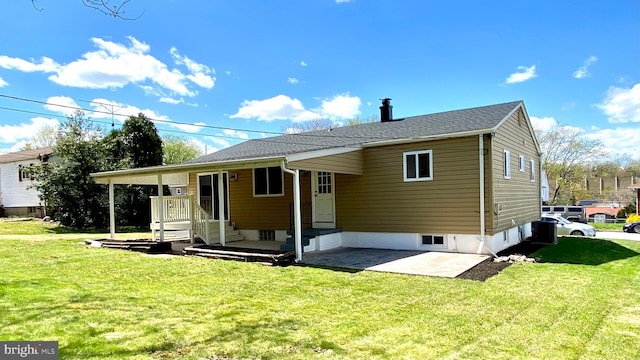 8107 Candle Ln, Baltimore, MD 21237 - back of property with a lawn and a patio area