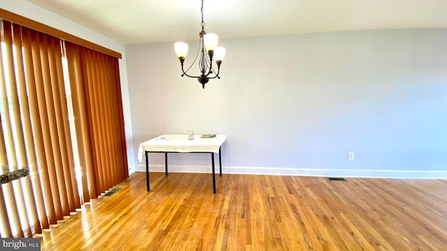 8107 Candle Ln, Baltimore, MD 21237 - dining room featuring light wood-style floors, visible vents, baseboards, and an inviting chandelier