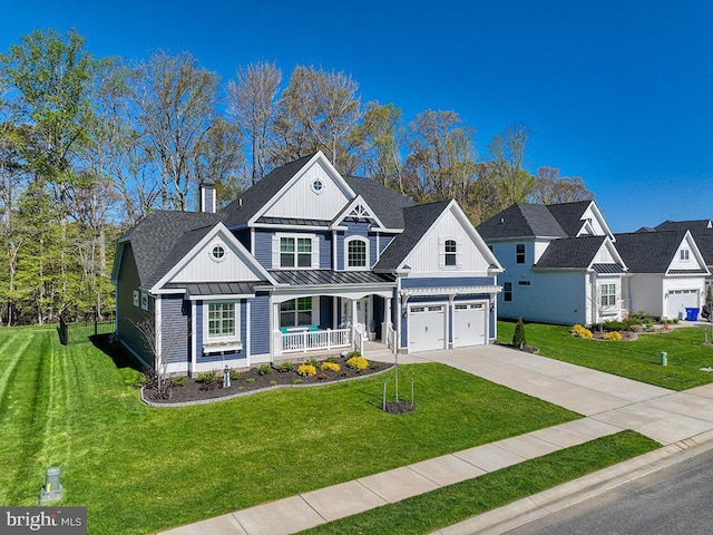22144 Welches Way, Lewes, DE 19958 - view of front of property featuring covered porch, a standing seam roof, board and batten siding, and a front yard