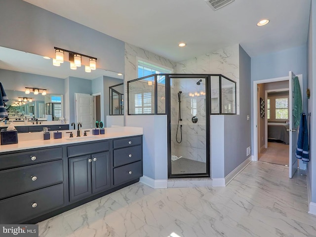 22144 Welches Way, Lewes, DE 19958 - ensuite bathroom with plenty of natural light, marble look tile flooring, baseboards, a marble finish shower, and recessed lighting