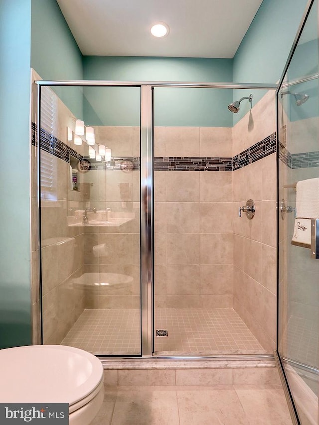 22144 Welches Way, Lewes, DE 19958 - full bathroom with toilet, a stall shower, tile patterned floors, and recessed lighting