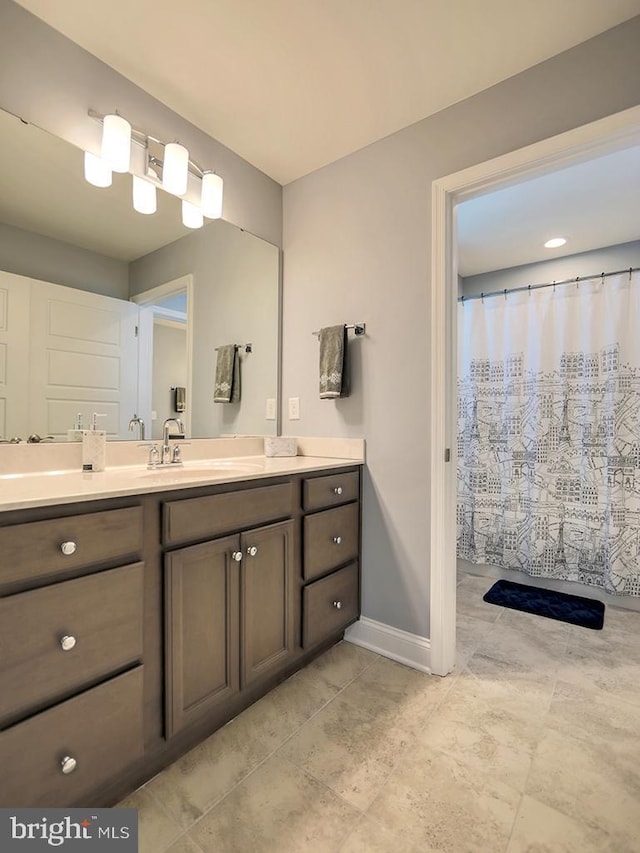 22144 Welches Way, Lewes, DE 19958 - bathroom with baseboards, vanity, and curtained shower