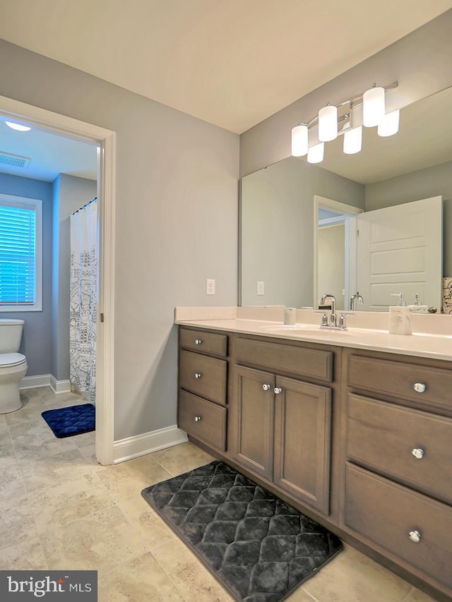 22144 Welches Way, Lewes, DE 19958 - bathroom with toilet, vanity, and baseboards