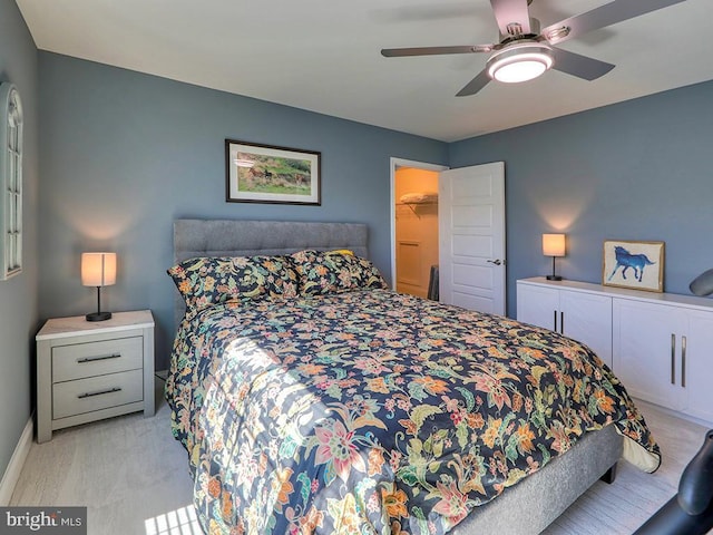 22144 Welches Way, Lewes, DE 19958 - bedroom featuring light colored carpet, a spacious closet, a ceiling fan, baseboards, and a closet
