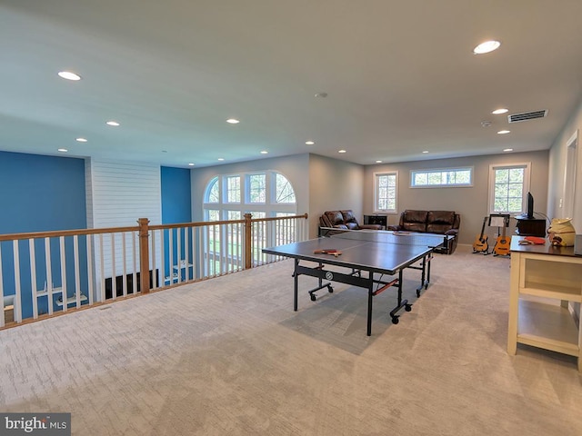 recreation room featuring recessed lighting, healthy amount of natural light, and carpet