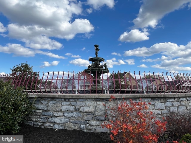view of swimming pool featuring fence