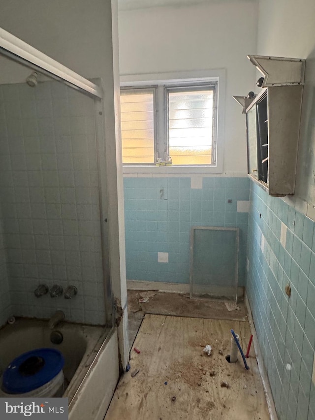 2555 N 33rd St, Philadelphia, PA 19132 - full bathroom featuring tub / shower combination, tile walls, and wainscoting