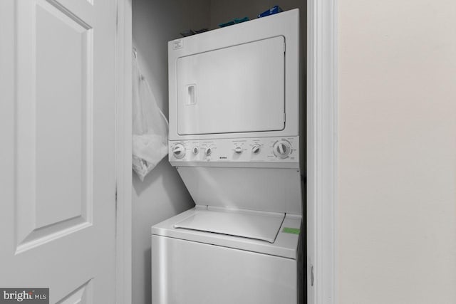 laundry area with laundry area and stacked washer and clothes dryer